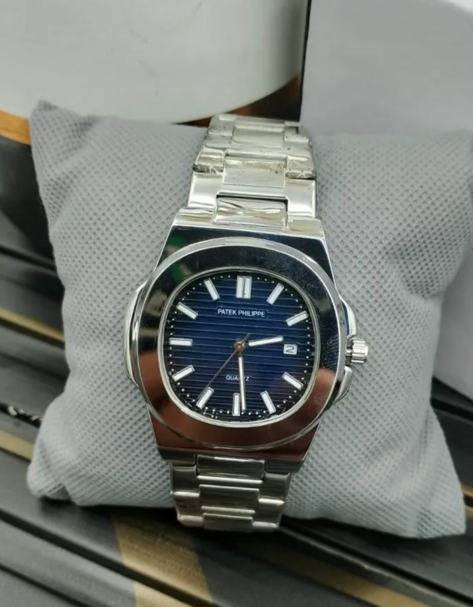 Patek Philippe stainless steel luxury watch with blue dial, date display, and elegant design for men – premium wristwatch
