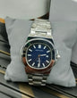 Patek Philippe stainless steel luxury watch with blue dial, date display, and elegant design for men – premium wristwatch